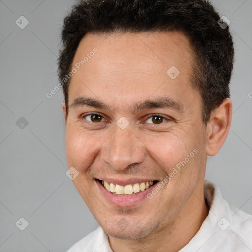 Joyful white adult male with short  brown hair and brown eyes