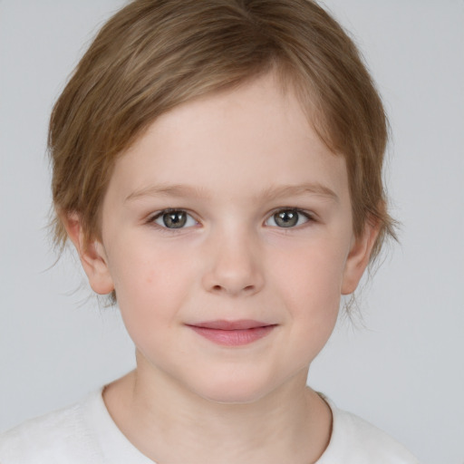 Joyful white child female with short  brown hair and brown eyes