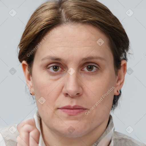 Joyful white adult female with short  brown hair and brown eyes