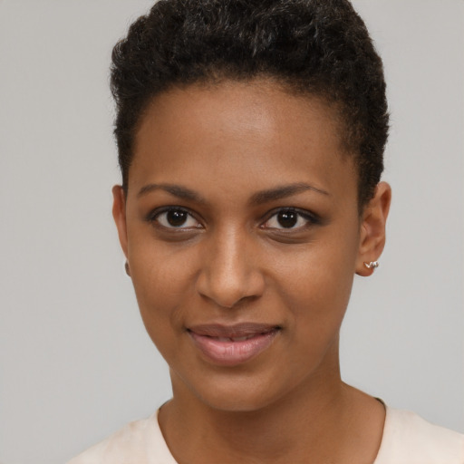 Joyful black young-adult female with short  brown hair and brown eyes