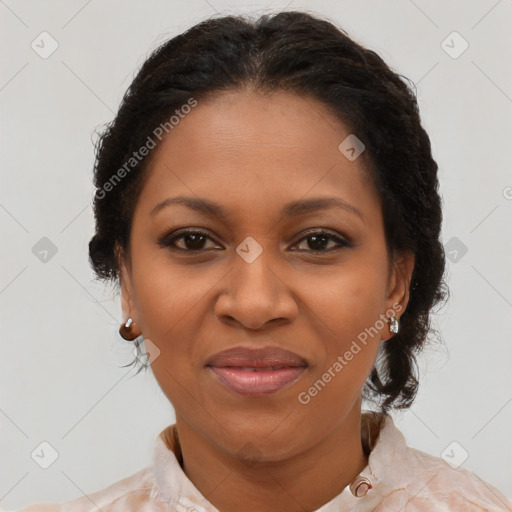 Joyful black adult female with medium  brown hair and brown eyes