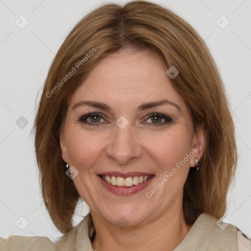 Joyful white adult female with medium  brown hair and brown eyes