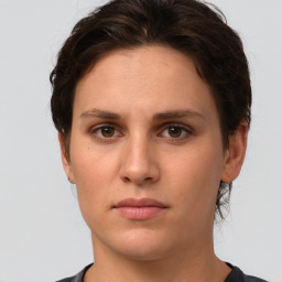 Neutral white young-adult female with short  brown hair and brown eyes