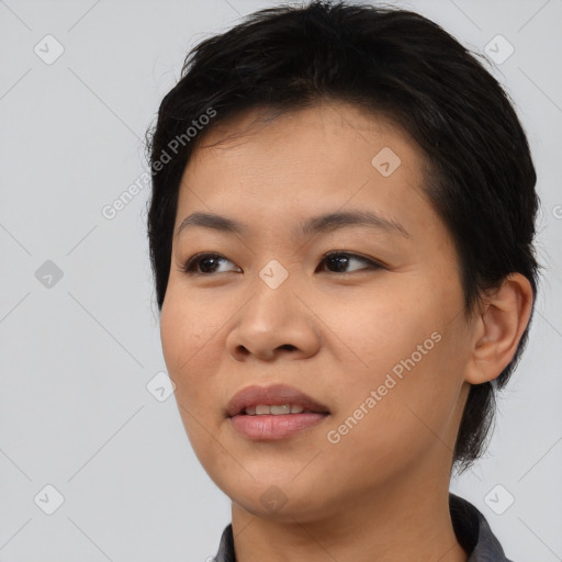 Joyful asian young-adult female with medium  black hair and brown eyes