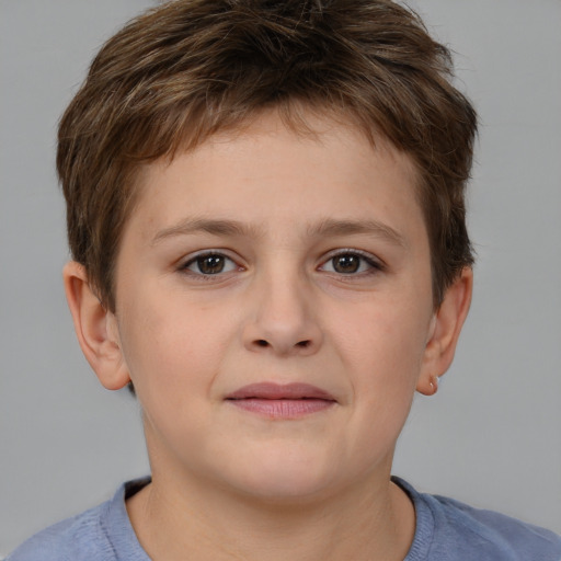 Joyful white child male with short  brown hair and brown eyes