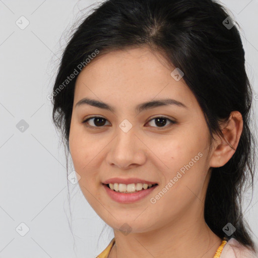 Joyful latino young-adult female with medium  brown hair and brown eyes