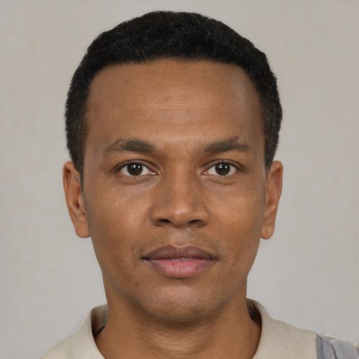 Neutral black young-adult male with short  black hair and brown eyes
