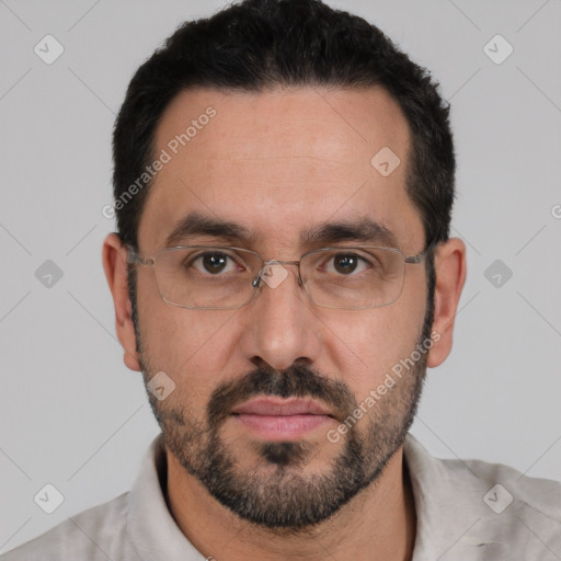 Joyful white adult male with short  black hair and brown eyes