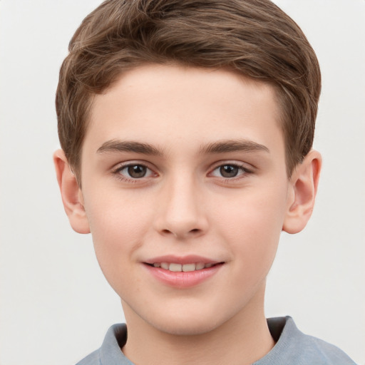 Joyful white child male with short  brown hair and grey eyes