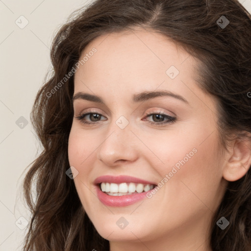 Joyful white young-adult female with long  brown hair and green eyes