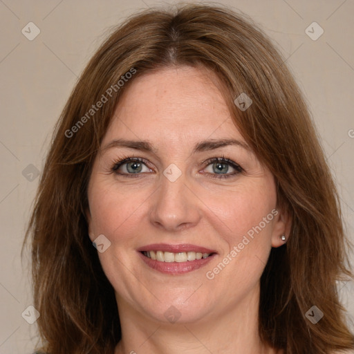 Joyful white adult female with medium  brown hair and green eyes