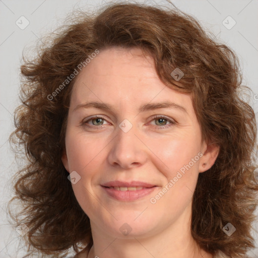 Joyful white young-adult female with medium  brown hair and green eyes