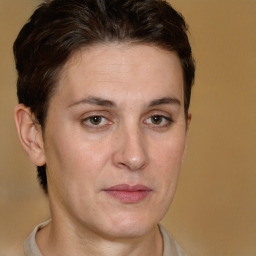 Joyful white adult female with short  brown hair and brown eyes