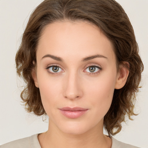 Neutral white young-adult female with medium  brown hair and green eyes