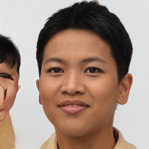 Joyful asian young-adult female with short  black hair and brown eyes