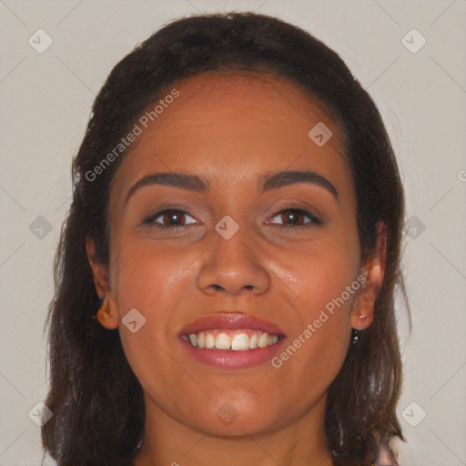 Joyful white young-adult female with long  brown hair and brown eyes