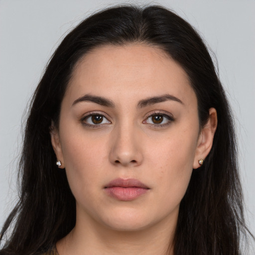 Neutral white young-adult female with long  brown hair and brown eyes