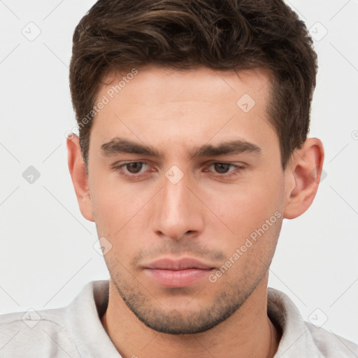 Neutral white young-adult male with short  brown hair and brown eyes