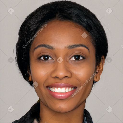 Joyful black young-adult female with long  black hair and brown eyes