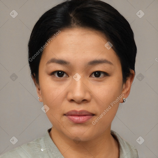 Joyful asian young-adult female with short  black hair and brown eyes