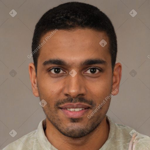 Joyful black young-adult male with short  brown hair and brown eyes