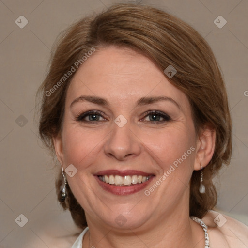 Joyful white adult female with medium  brown hair and brown eyes