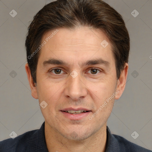 Joyful white adult male with short  brown hair and brown eyes