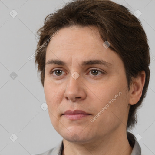 Joyful white adult female with short  brown hair and brown eyes