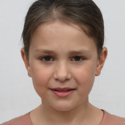 Joyful white child female with short  brown hair and brown eyes