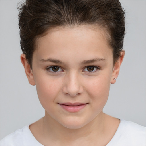 Joyful white child female with short  brown hair and brown eyes