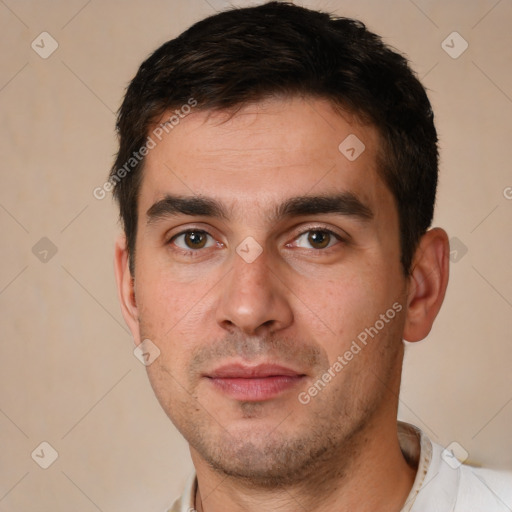 Joyful white young-adult male with short  brown hair and brown eyes