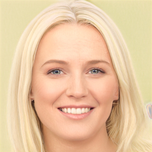 Joyful white young-adult female with long  blond hair and blue eyes