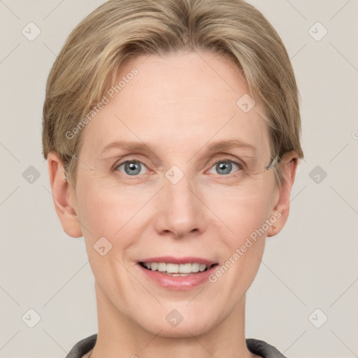 Joyful white adult female with short  brown hair and grey eyes