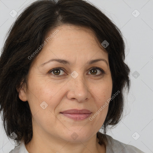 Joyful white adult female with medium  brown hair and brown eyes