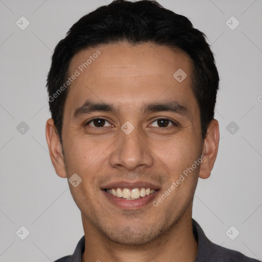 Joyful white young-adult male with short  black hair and brown eyes