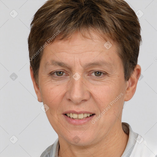 Joyful white adult female with short  brown hair and grey eyes