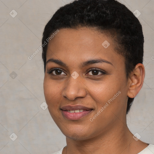 Joyful black young-adult female with short  black hair and brown eyes