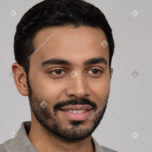 Joyful latino young-adult male with short  black hair and brown eyes