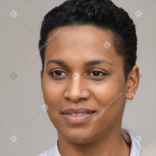 Joyful black young-adult female with short  black hair and brown eyes