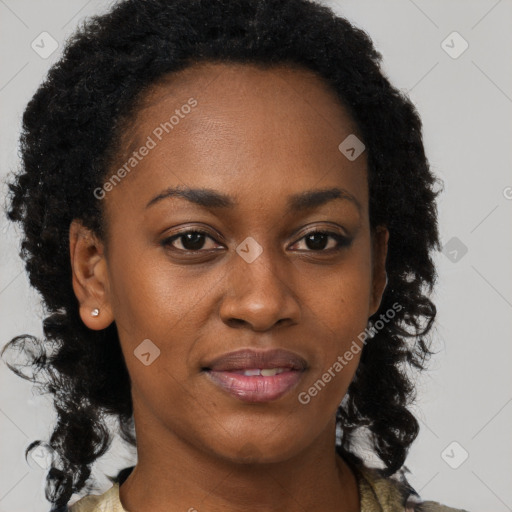 Joyful black adult female with short  brown hair and brown eyes