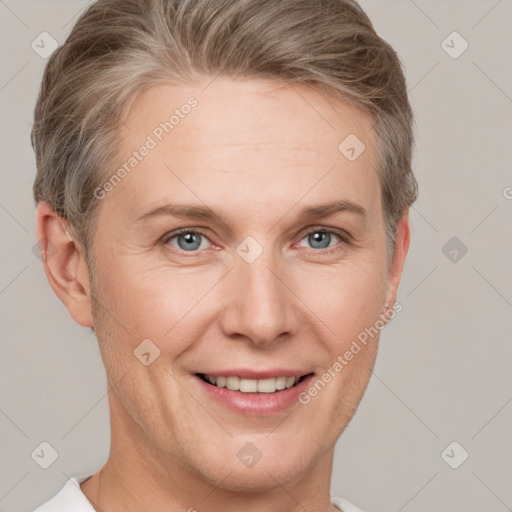 Joyful white adult female with short  brown hair and grey eyes