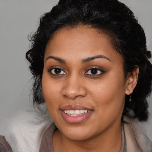 Joyful latino young-adult female with long  brown hair and brown eyes
