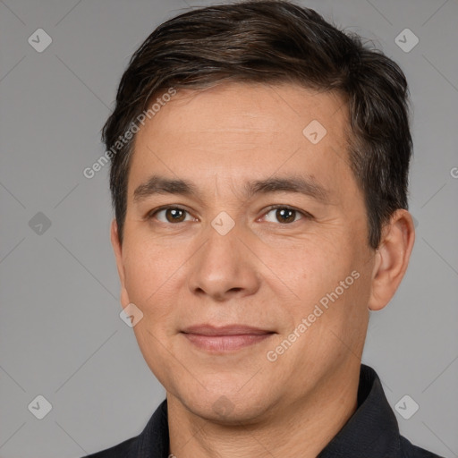 Joyful white adult male with short  brown hair and brown eyes