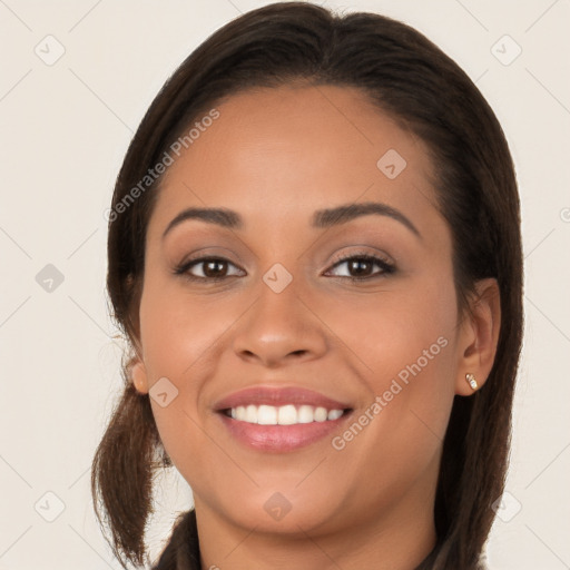 Joyful white young-adult female with long  brown hair and brown eyes