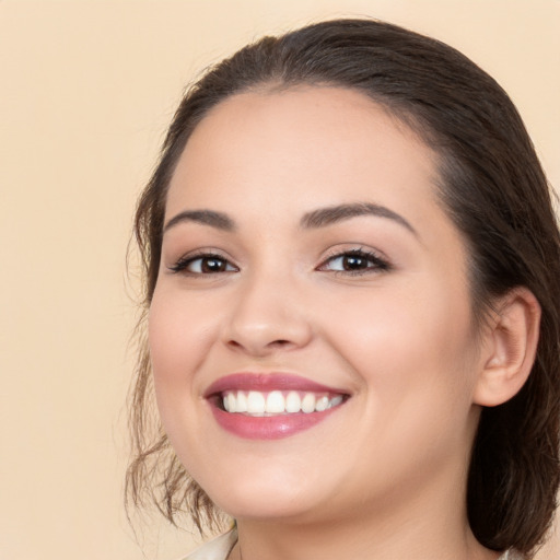 Joyful white young-adult female with medium  brown hair and brown eyes