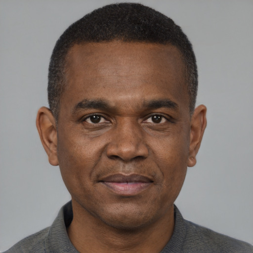Neutral black adult male with short  black hair and brown eyes