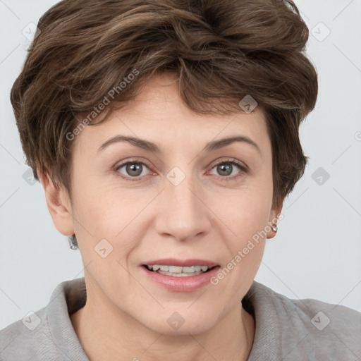 Joyful white adult female with short  brown hair and brown eyes