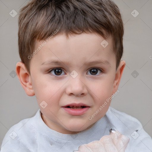 Joyful white child male with short  brown hair and brown eyes