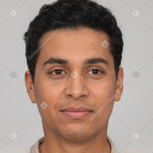 Joyful latino young-adult male with short  black hair and brown eyes