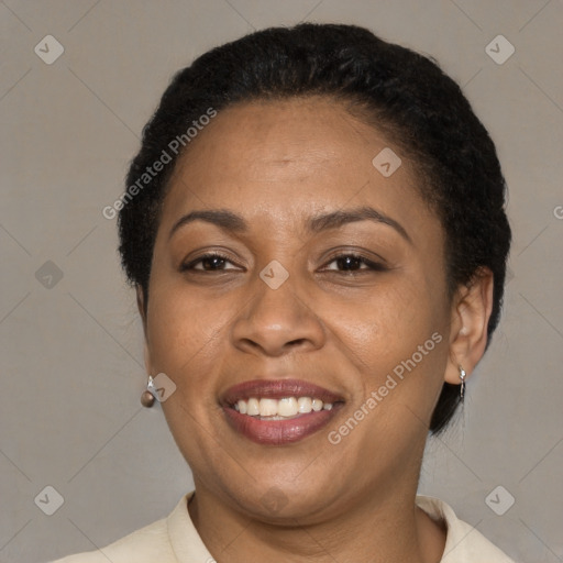 Joyful latino adult female with short  brown hair and brown eyes